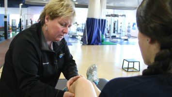 Kerry Waple, an athletic trainer at Nationwide Children`s Hospital, examines the knee of a young athlete.  Fewer than half of all high schools employ athletic trainers and the numbers may be even worse in middle schools.  Researchers at Nationwide Children`s Hospital say athletic trainers can play an important role in more efficiently treating student athletes and rehabbing them safely to return to play.  Experts looked at high school basketball injuries between 2005-2011, and found that injured players went to emergency departments 42% more often, sometimes unnecessarily.