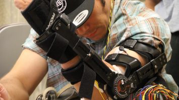 Brian Gomez works on building his arm strength during a therapy session at Ronald Reagan UCLA Medical Center. After being paralyzed in an accident in 2011, Gomez became one of the first patients in the world to have an experimental stimulator implanted near the damaged area of his spine in an effort to help him regain partial use of his hands.