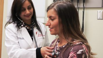 Cardiologist Dr. Laxmi Mehta examines a patient at The Ohio State University Wexner Medical Center. She worked with the American Heart Association to author the first scientific statement about breast cancer and heart disease.